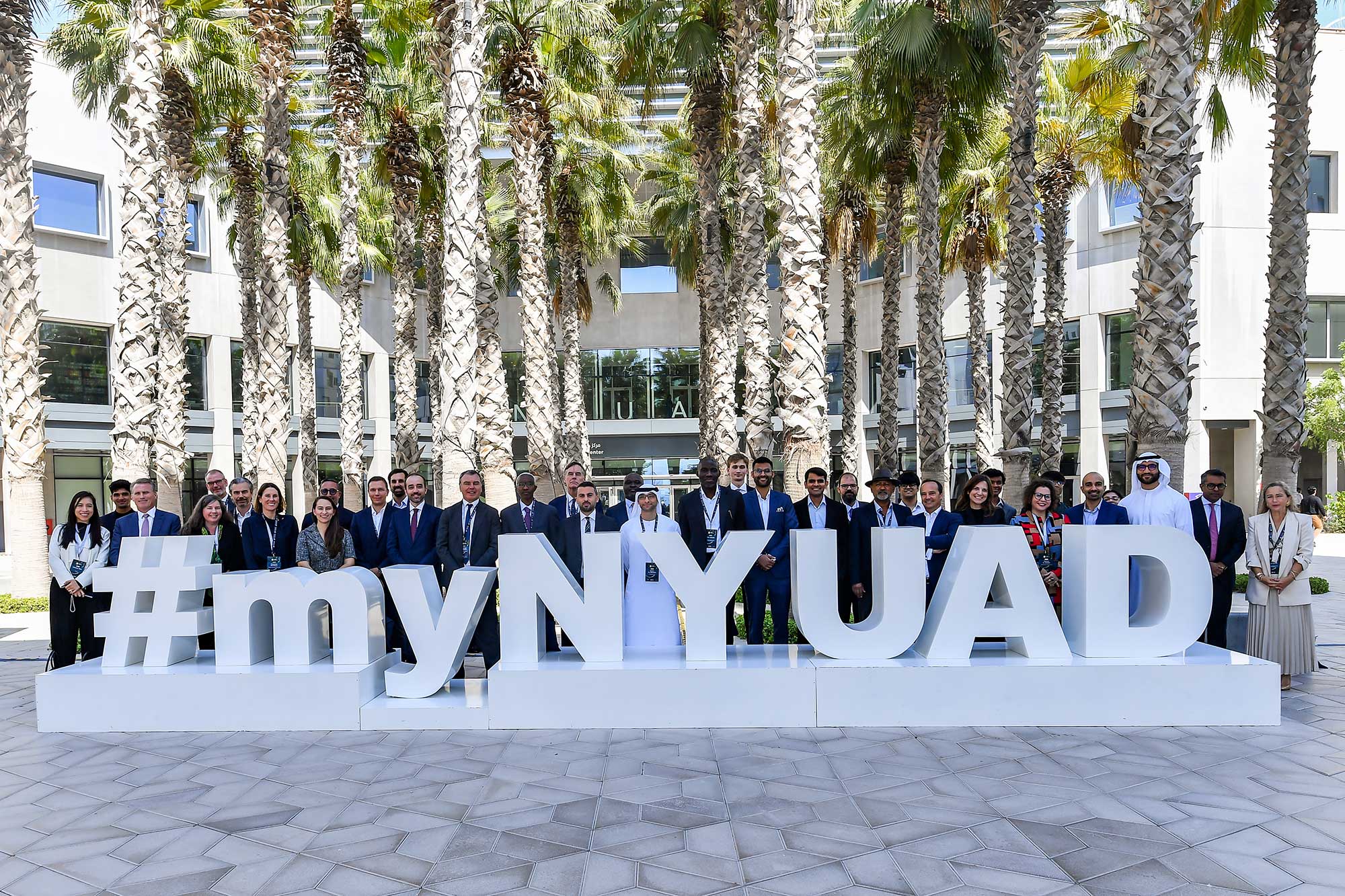 Participants of the Transition Investment Lab conference stand for a group photo in Sexton Square.